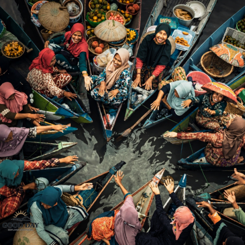 Local women trading fruits and snacks on boats in Banjarmasin