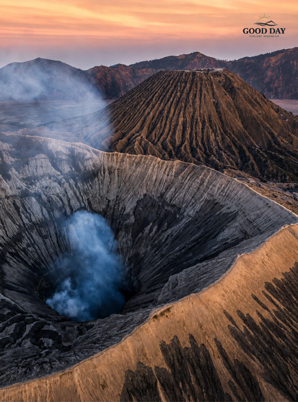 Smoke rising from Mount Bromo crater during sunrise
