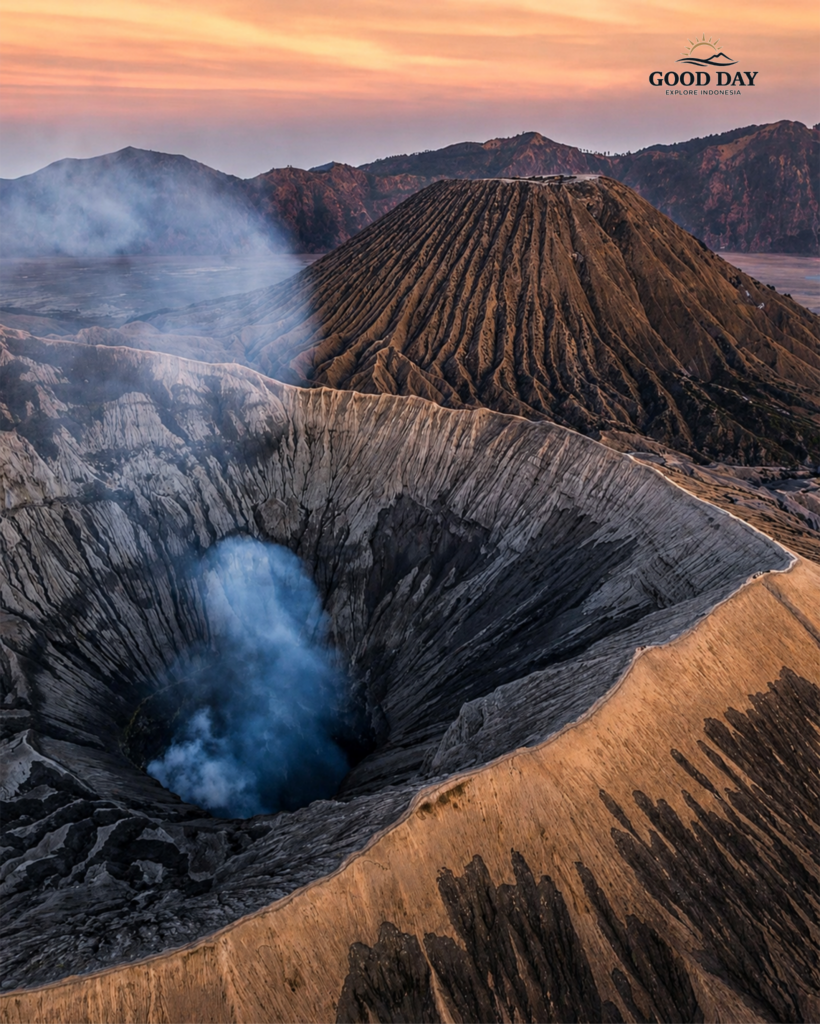 Smoke rising from Mount Bromo crater during sunrise