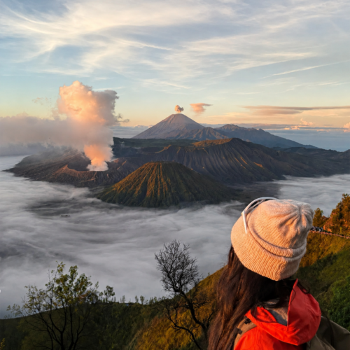 Woman enjoying Mount Bromo sunrise view in Indonesia