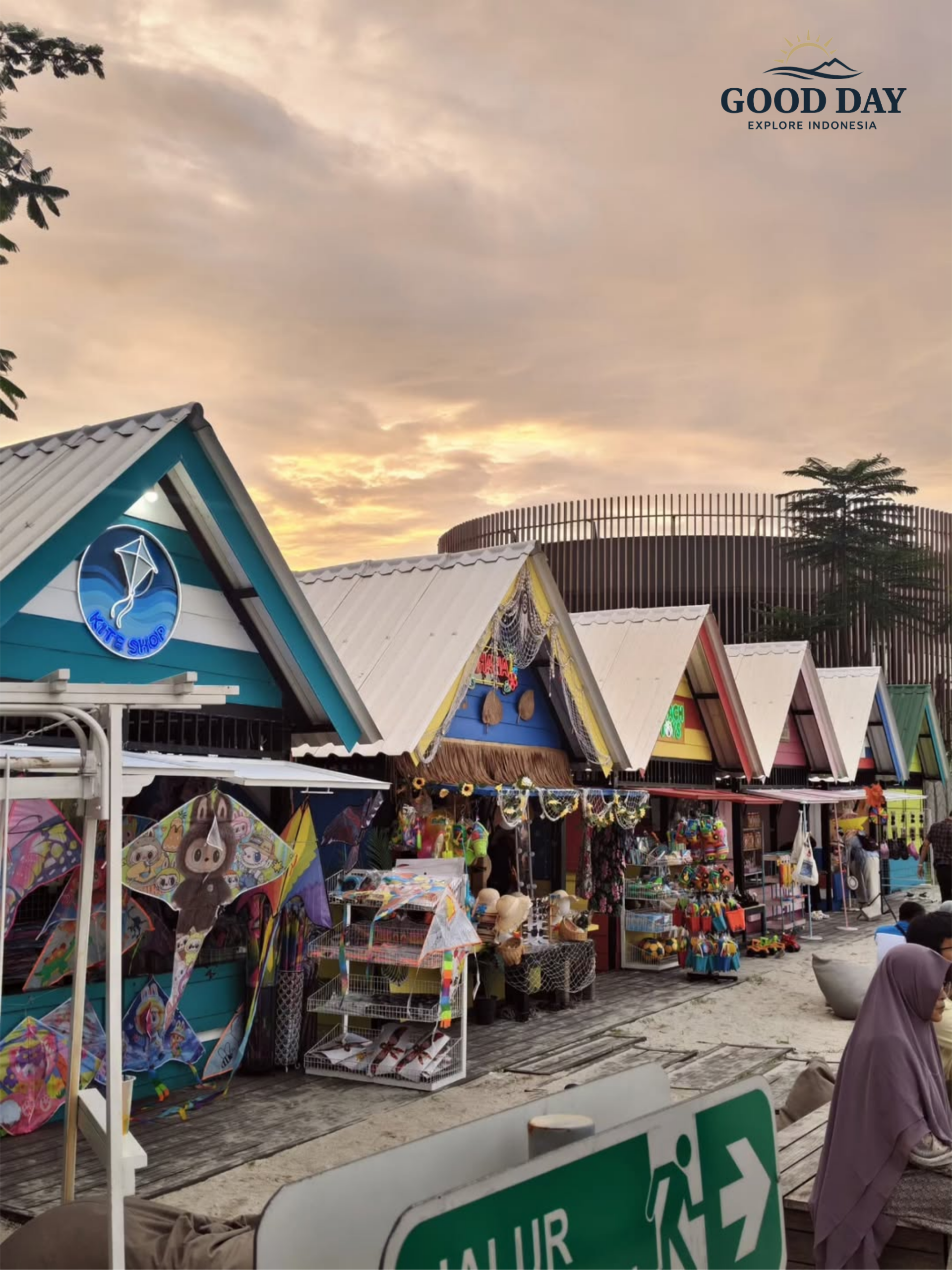 Colorful beachside souvenir shops at Aloha PIK Jakarta during sunset, featuring local merchandise, kites, and a tropical coastal atmosphere in Pantai Indah Kapuk.