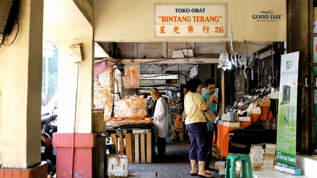 Traditional shop corridor in Glodok Chinatown Jakarta featuring local merchants, heritage storefronts, and shoppers exploring one of the city's oldest commercial districts.