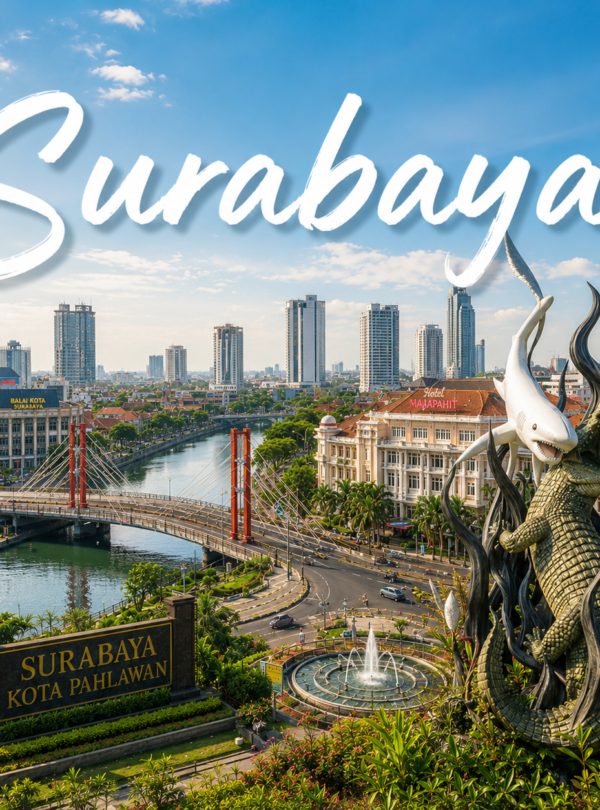 Surabaya city skyline in East Java, Indonesia, featuring the iconic Suro and Boyo statue, modern skyscrapers, riverside cityscape, historic buildings, and bright blue sky during daytime.