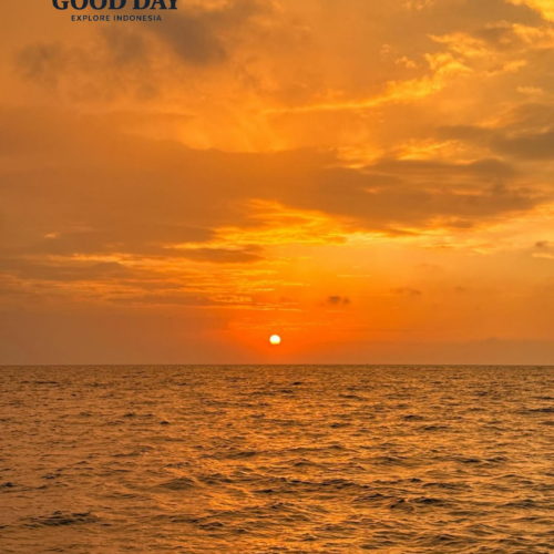 Golden sunset over the calm waters of the Thousand Islands (Pulau Seribu), Indonesia, with the sun resting near the horizon and vibrant orange clouds illuminating the tropical seascape.