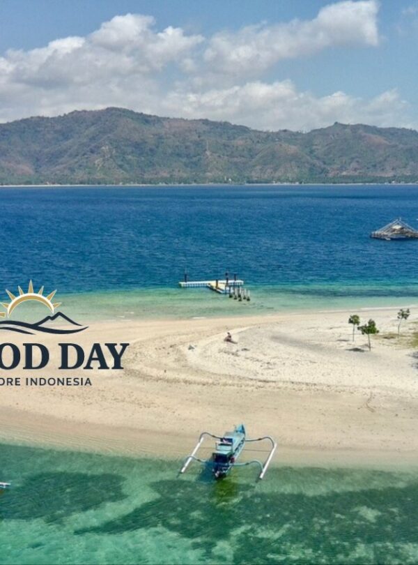 Aerial view of a pristine Gili island in Lombok featuring a white sandbar, crystal-clear turquoise waters, traditional Indonesian outrigger boats, and a tropical shoreline surrounded by the stunning coastline of Lombok.