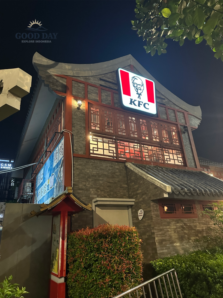 KFC Pantjoran PIK Jakarta at night featuring traditional Chinese-inspired architecture, illuminated signage, and elegant East Asian design elements in the vibrant Pantai Indah Kapuk lifestyle district.