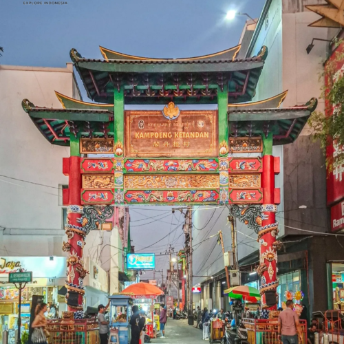 The iconic Kampoeng Ketandan gate in Malioboro, Yogyakarta, Indonesia, illuminated at night and marking the entrance to the city's historic Chinese heritage district and culinary area.