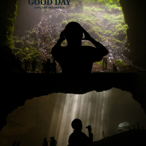 Visitors exploring Jomblang Cave in Yogyakarta, Indonesia, standing beneath the cave's massive sinkhole and the famous Heaven's Light sunbeams that illuminate the underground chamber.