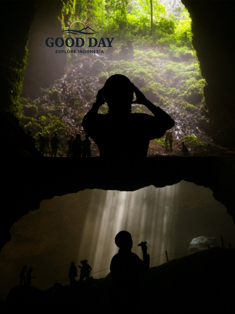 Visitors exploring Jomblang Cave in Yogyakarta, Indonesia, standing beneath the cave's massive sinkhole and the famous Heaven's Light sunbeams that illuminate the underground chamber.