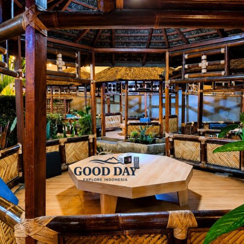 Traditional Sundanese restaurant in Bandung featuring private bamboo dining gazebos, wooden architecture, woven bamboo details, tropical plants, and a cozy open-air atmosphere.
