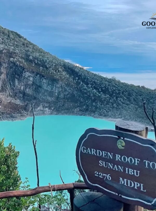 Panoramic view of Kawah Putih Bandung from Sunan Ibu Viewpoint, featuring a stunning turquoise volcanic crater lake surrounded by dramatic cliffs and lush mountain landscapes in Ciwidey, West Java.