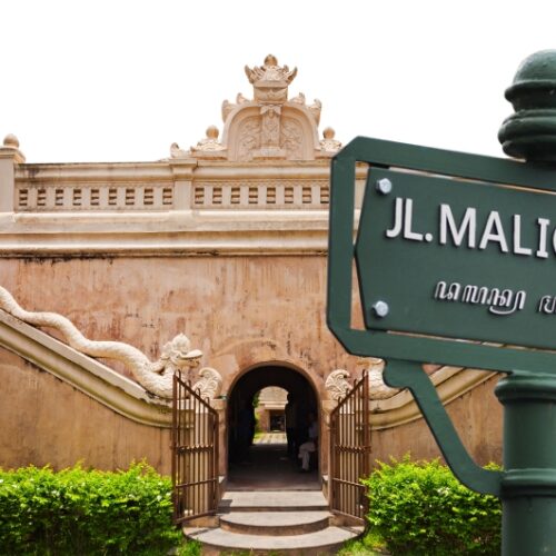 Malioboro Street sign near a historic building in Yogyakarta, Indonesia during Good Day cultural heritage motorbike tour