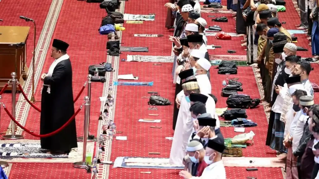 Muslim worshippers performing congregational prayer inside Istiqlal Mosque in Jakarta, Indonesia, the largest mosque in Southeast Asia.