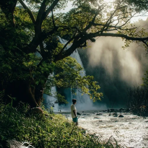 Travelers exploring Geopark Ciletuh in West Java on a one-day trip from Jakarta with Good Day Tour, featuring spectacular waterfalls, rainforest, cliffs, and UNESCO Global Geopark landscapes.