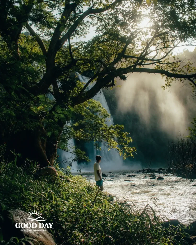 Travelers exploring Geopark Ciletuh in West Java on a one-day trip from Jakarta with Good Day Tour, featuring spectacular waterfalls, rainforest, cliffs, and UNESCO Global Geopark landscapes.