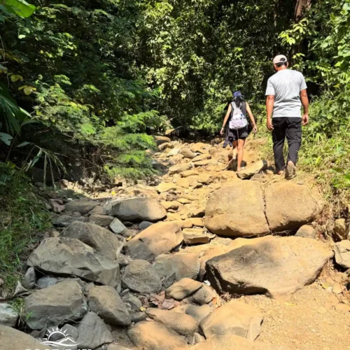 Travelers exploring Geopark Ciletuh in West Java on a one-day trip from Jakarta with Good Day Tour, featuring spectacular waterfalls, rainforest, cliffs, and UNESCO Global Geopark landscapes.