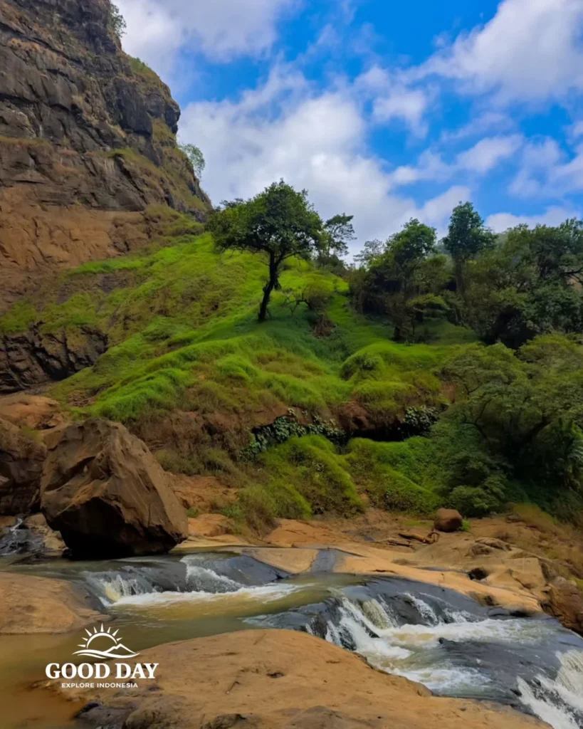 Travelers exploring Geopark Ciletuh in West Java on a one-day trip from Jakarta with Good Day Tour, featuring spectacular waterfalls, rainforest, cliffs, and UNESCO Global Geopark landscapes.