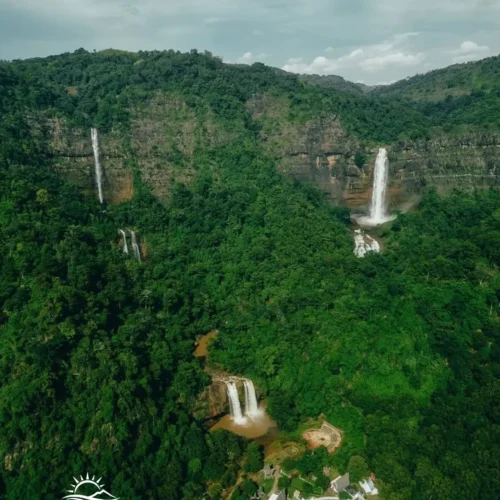 Travelers exploring Geopark Ciletuh in West Java on a one-day trip from Jakarta with Good Day Tour, featuring spectacular waterfalls, rainforest, cliffs, and UNESCO Global Geopark landscapes.