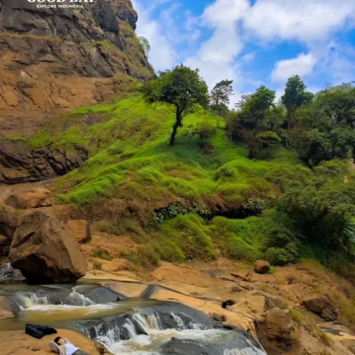 Travelers exploring Geopark Ciletuh in West Java on a one-day trip from Jakarta with Good Day Tour, featuring spectacular waterfalls, rainforest, cliffs, and UNESCO Global Geopark landscapes.